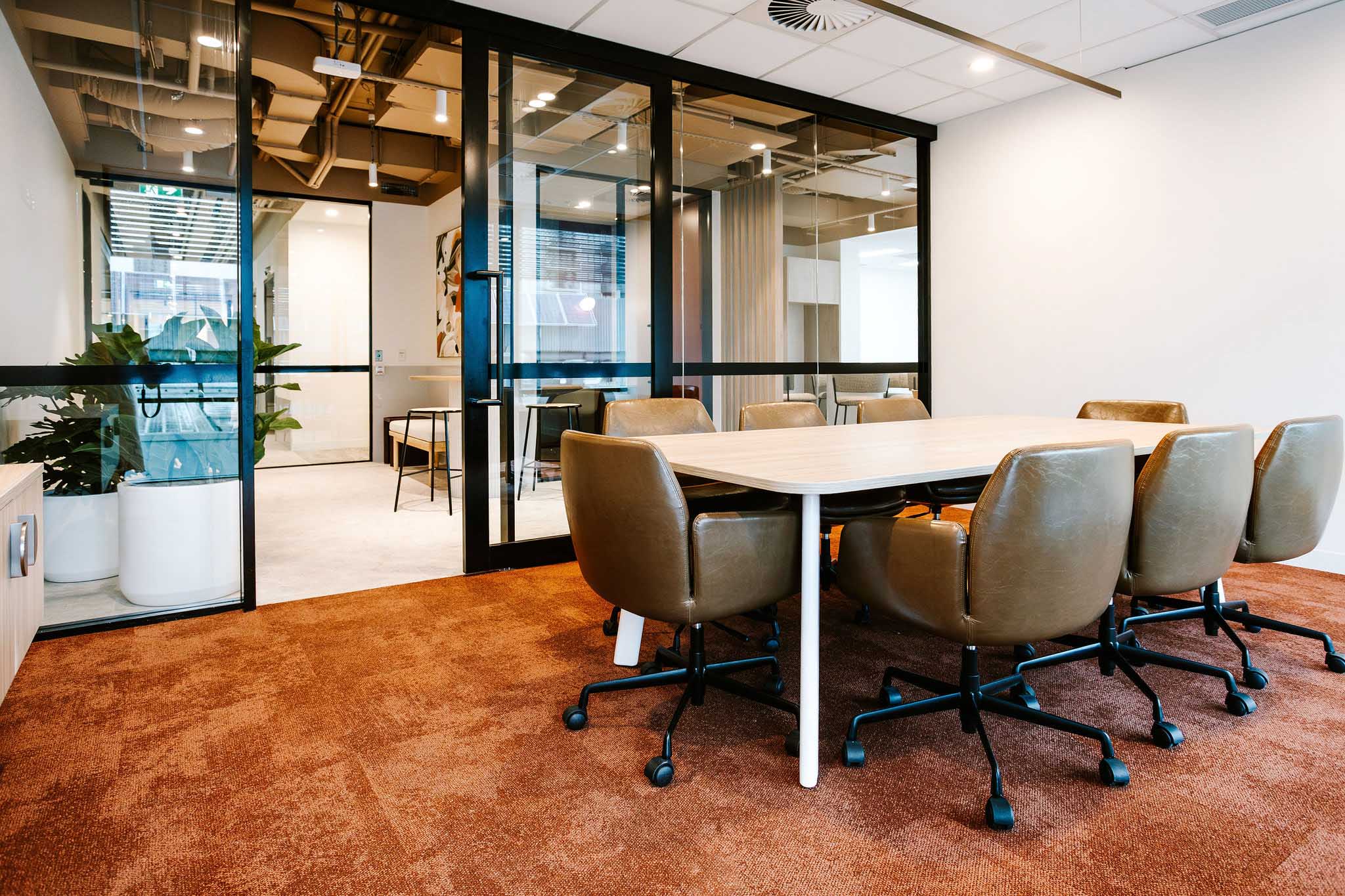Boardroom table with leather meeting chairs