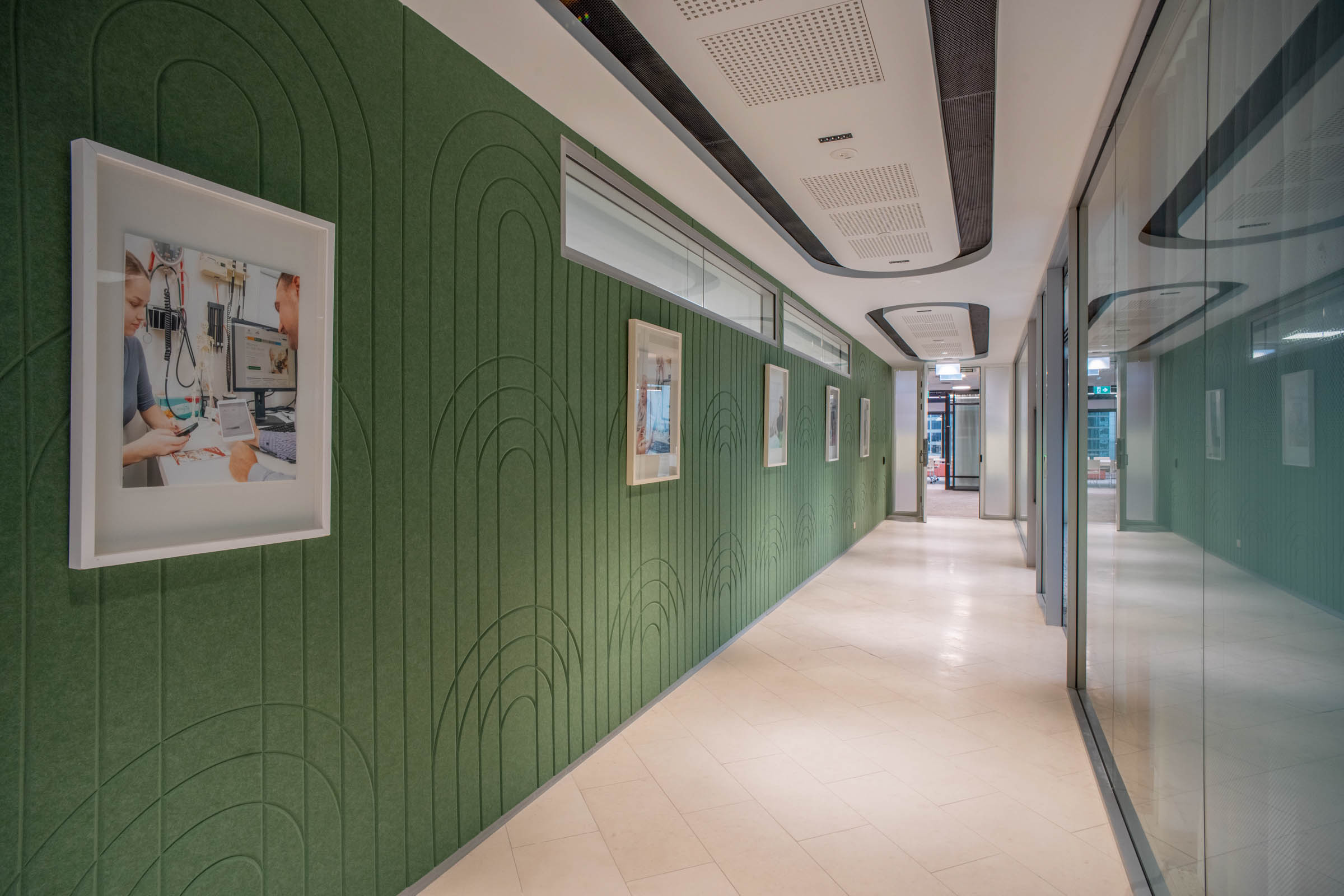 Green grooved acoustics in hallway